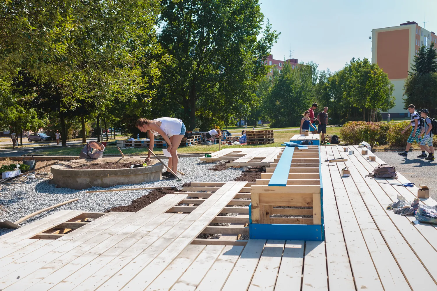 The team assembling the wooden deck boards on site